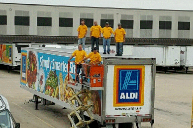 Crew Installing Fleet Graphics on a Truck